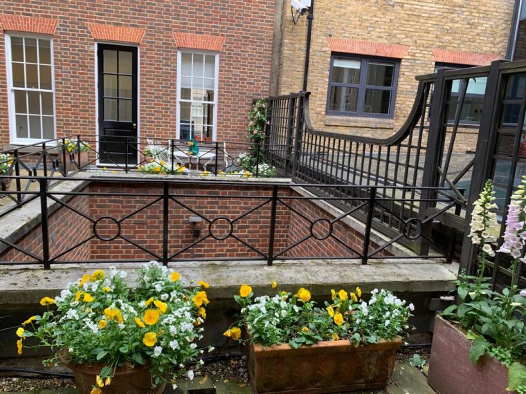 Planters around an outside first-floor terrace