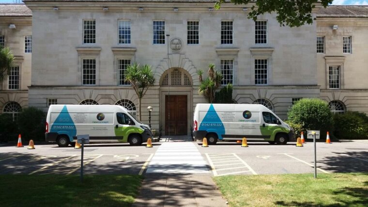 IMage of two New-Concept vans parked in front of Surrey County Council Offices